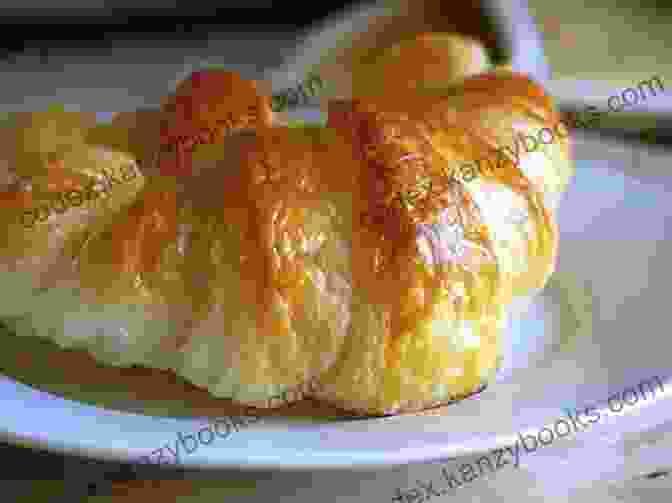 A Close Up Shot Of A Perfectly Golden Croissant The Ultimate Baking Cookbook: Classic Sweet Treats And Savory Bakes For All Seasons